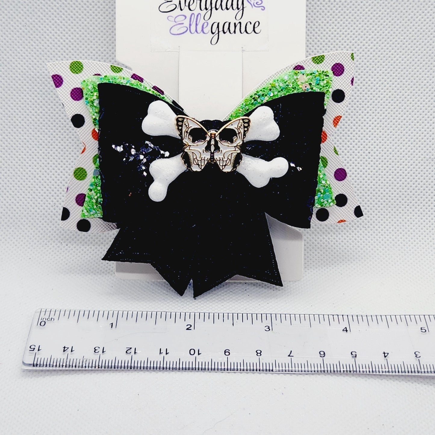 Halloween Sequined Polka Dot Skull and Crossbones Bow with a Butterfly Skull Accent