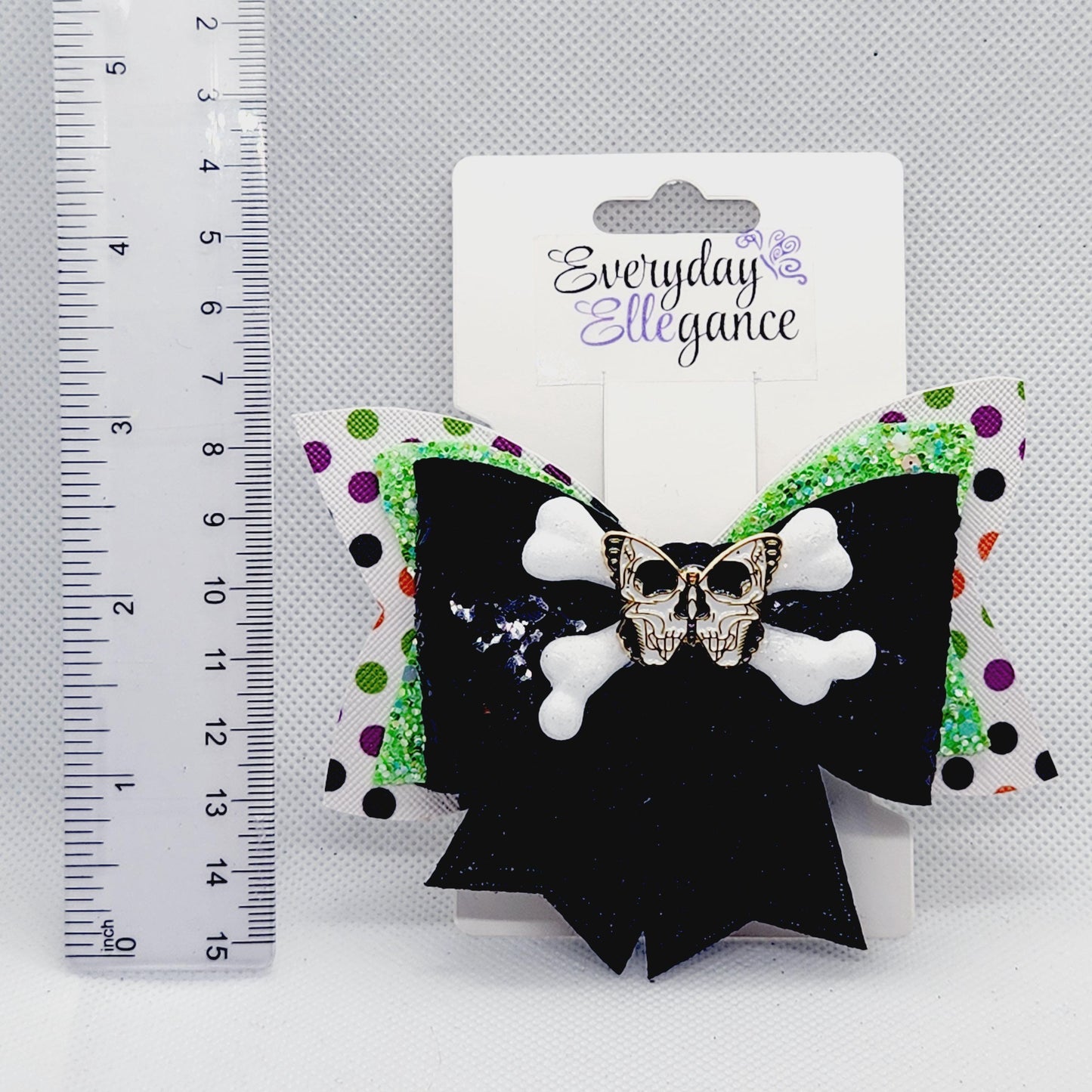 Halloween Sequined Polka Dot Skull and Crossbones Bow with a Butterfly Skull Accent